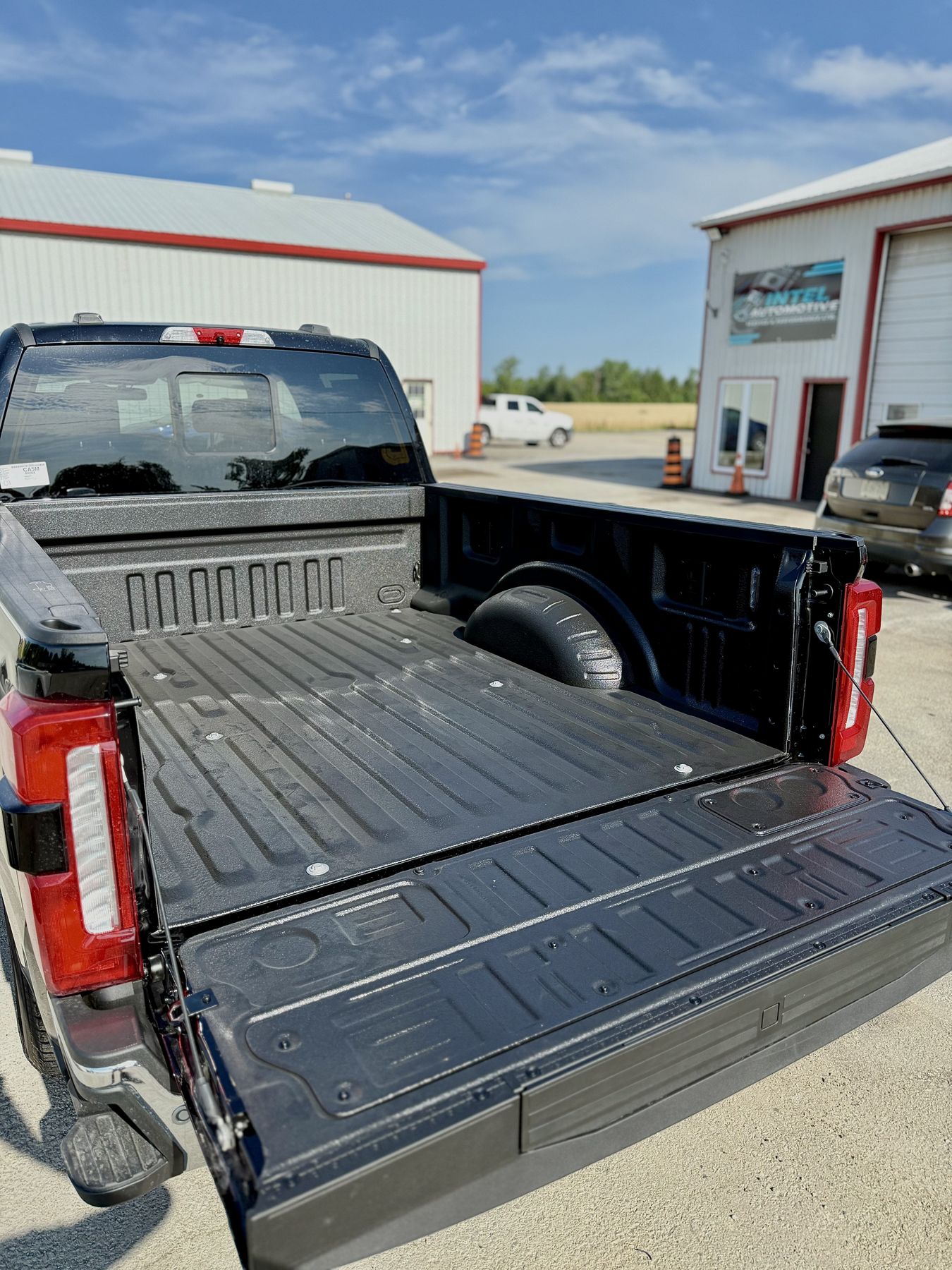 Spray-on truck bedliner installation with tool box, Windsor Ontario