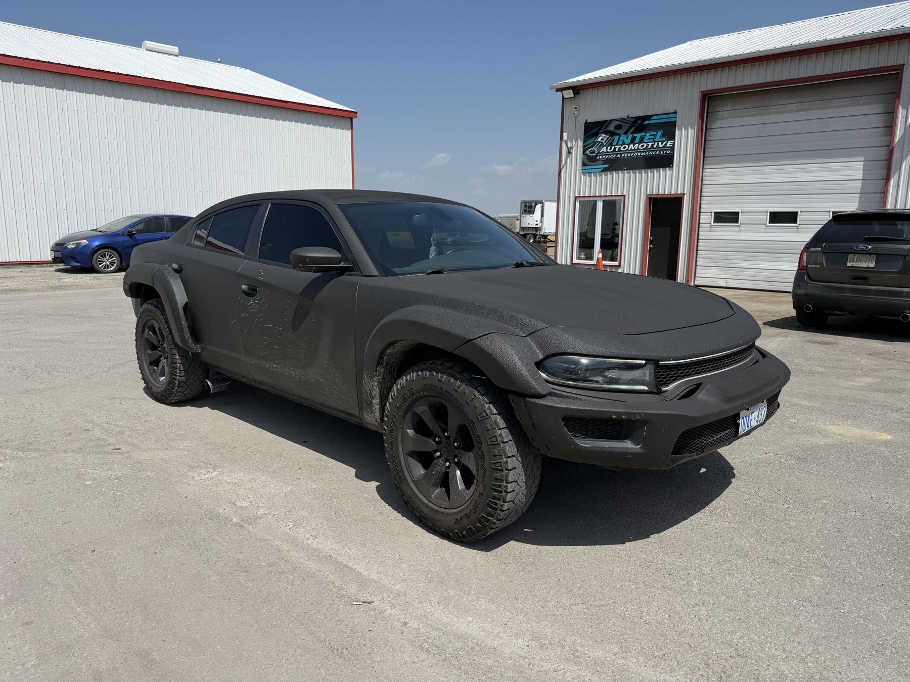 Full vehicle spray-on coating, matte black finish